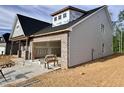 Angle view of a gray home with a two-car garage still under construction at 1073 Fairhaven Dr # 52, Mebane, NC 27302
