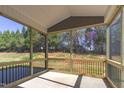 Relaxing screened porch with a scenic view of the backyard and wooded area at 1073 Fairhaven Dr # 52, Mebane, NC 27302