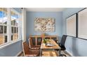 Bright office featuring light blue walls, a wood desk, and a large window at 1204 Pavo Path, Wendell, NC 27591