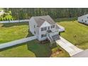 Spacious home on a large lot featuring a fenced backyard and an attached two-car garage at 1209 Huffington Oak Dr, Willow Springs, NC 27592