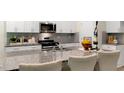 Well-equipped kitchen featuring granite countertops, stainless steel appliances, and ample cabinet space at 1216 Pavo Path, Wendell, NC 27591