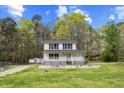 Charming two-story home with a classic design and a well-maintained front lawn at 124 Maluli Dr, Oxford, NC 27565