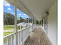 Inviting front porch with white railings, offering a relaxing outdoor space at 124 Maluli Dr, Oxford, NC 27565