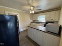 Traditional kitchen features an island and all essential appliances at 1278 Valley Ct, Zebulon, NC 27597