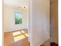 Cozy bedroom with hardwood floors and a window offering plenty of natural light at 1308 Wake Forest Rd, Raleigh, NC 27604