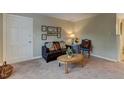 Inviting living room featuring a plush sofa and neutral decor at 1700 W Front St # 36 D, Burlington, NC 27215