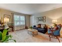Cozy living room with neutral tones, comfortable seating, and natural light from a bright window at 1700 W Front St # 36 D, Burlington, NC 27215
