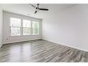 Spacious bedroom featuring large windows and modern flooring at 1817 Shady Oaks Dr, Wendell, NC 27591