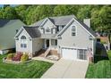 Beautiful two-story home featuring manicured lawn and a two-car attached garage at 212 Mickleson Ridge Dr, Raleigh, NC 27603