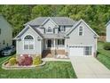 Inviting two-story home with manicured lawn and a convenient two-car garage at 212 Mickleson Ridge Dr, Raleigh, NC 27603