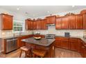 Spacious kitchen featuring granite countertops, stainless steel appliances, and ample cabinet storage at 2317 Rainy Lake St, Wake Forest, NC 27587
