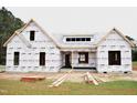 Exterior view of a home under construction with protective wrap, framing the structure's layout at 4330 Medicus Ln, Franklinton, NC 27525