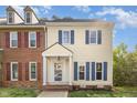 Charming two-story home featuring blue shutters, cream siding, and a welcoming front entrance at 5013 Dunwoody Trl, Raleigh, NC 27606