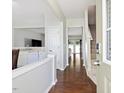 Light and airy foyer featuring hardwood floors, stairs, and an open view to the living space at 5044 Brooke Lauren Ln, Raleigh, NC 27616