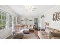 Inviting living room with hardwood floors, large windows and comfortable seating arrangements at 5064 Murrell Dr, Oxford, NC 27565