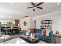Open concept living area with modern decor, seamlessly connecting to the dining and kitchen areas at 52 E American Marigold Dr # 63, Benson, NC 27504