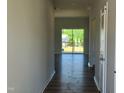 Inviting entryway with modern flooring and a view of the backyard and deck through large glass doors at 84 Grove Township Way, Angier, NC 27501