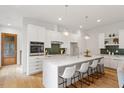 Bright kitchen with stainless steel appliances, quartz countertops, and stylish pendant lighting at 1007 E Davie St, Raleigh, NC 27601