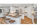 Bright kitchen with stainless steel appliances, ample counter space, and a view into the living room at 103 Berry Mill Ln # 133, Raleigh, NC 27603