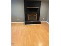 Cozy living space with a brick fireplace and mantel, ready for warm evenings at 108 Virgil Rd, Durham, NC 27703