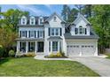 Stately brick home with gabled roof, dormers, and a manicured front lawn at 111 Finnway Ln, Cary, NC 27519