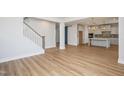 Spacious open floor plan connecting the living area, stairs, and kitchen at 1245 Porters Call Dr, Wendell, NC 27591