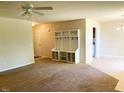 Open living room featuring neutral colors and built-in storage at 164 Sue Dr, Angier, NC 27501