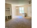 Bright open floor plan with neutral paint and a storage unit at 164 Sue Dr, Angier, NC 27501