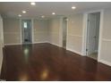 Open-concept living area with recessed lighting and multiple doorways at 176 Fletcher Ave, Fuquay Varina, NC 27526