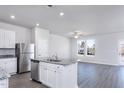 Open-concept kitchen features stainless appliances, granite countertops, and an island with a sink at 2122 Willow Gln Dr, Graham, NC 27253
