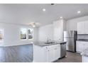 Open concept kitchen and living area with stainless steel appliances and granite countertops at 2126 Willow Gln Dr, Graham, NC 27253