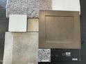 Sample materials for a new home include flooring, countertop, cabinet, and backsplash samples at 290 Deodora Ln, Cameron, NC 28326
