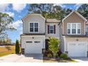 Charming home featuring a welcoming facade, landscaped yard, and attached garage at 301 White Oak Ridge Dr, Garner, NC 27529