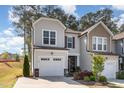 Charming home featuring a welcoming facade, landscaped yard, and attached garage at 301 White Oak Ridge Dr, Garner, NC 27529