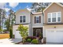 Charming home featuring a welcoming facade, landscaped yard, and attached garage at 301 White Oak Ridge Dr, Garner, NC 27529