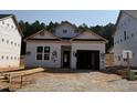 New construction home showcasing an unfinished exterior, bright windows, and a single-car garage awaiting your personal touch at 330 Bluejay St, Clayton, NC 27520