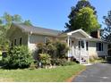 Lovely one-story home with a welcoming front porch, mature trees and meticulously maintained landscaping at 4159 Princeton Kenly Road, Kenly, NC 27542