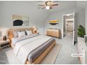 Staged bedroom with soft carpet, ceiling fan, and neutral tones at 501 Gooseneck Dr # B6, Cary, NC 27513