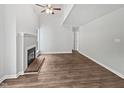 Bright living room featuring a fireplace, ceiling fan and hardwood floors at 501 Gooseneck Dr # B6, Cary, NC 27513