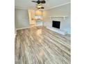Bright living room features refinished wood-look floors and a brick fireplace at 508 & 510 Gordon St, Roxboro, NC 27573