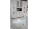 Stylish kitchen with white cabinets, modern hardware, and a coffee bar area at 6409 Lakeland Dr, Raleigh, NC 27612