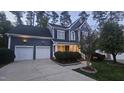 Charming two-story home with a two-car garage and well-maintained landscaping at 709 Basil Dr, Durham, NC 27713