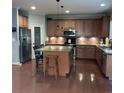 Spacious kitchen with a large island, stainless steel appliances, and ample cabinet space at 742 Keystone Park Dr, Morrisville, NC 27560