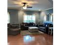 Cozy living room with hardwood floors, comfortable seating, and plenty of natural light at 742 Keystone Park Dr, Morrisville, NC 27560
