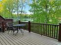 Relax on this backyard deck and enjoy the beautiful view overlooking the water at 8002 Upper Lake Dr, Raleigh, NC 27615