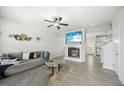 Spacious living room features sleek decor, a fireplace, and an open connection to the kitchen at 85 Sun Mdw Cir, Benson, NC 27504