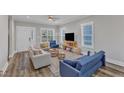 Bright and airy living room featuring hardwood floors and lots of natural light at 1008 Holloway St, Durham, NC 27701