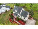 Aerial view showcasing the home's layout, landscaping, and spacious lot at 1053 Loop Rd, Clayton, NC 27527