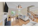 Bright living room with hardwood floors, fireplace, and plenty of natural light at 1053 Loop Rd, Clayton, NC 27527