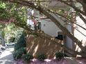 Brick townhome featuring multiple windows, neutral siding, landscaped lawn, and a covered entrance at 1062 Washington St # 201, Raleigh, NC 27605